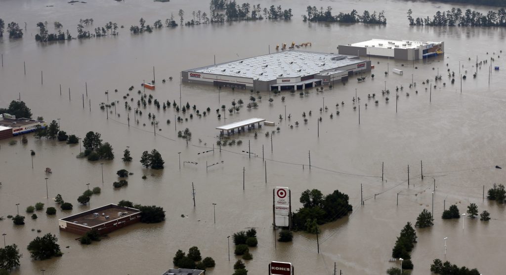 Businesses are surrounded by floodwaters from Tropical Storm Harvey Tuesday, Aug. 29, 2017, in Humble, Texas. (AP Photo/David J. Phillip)