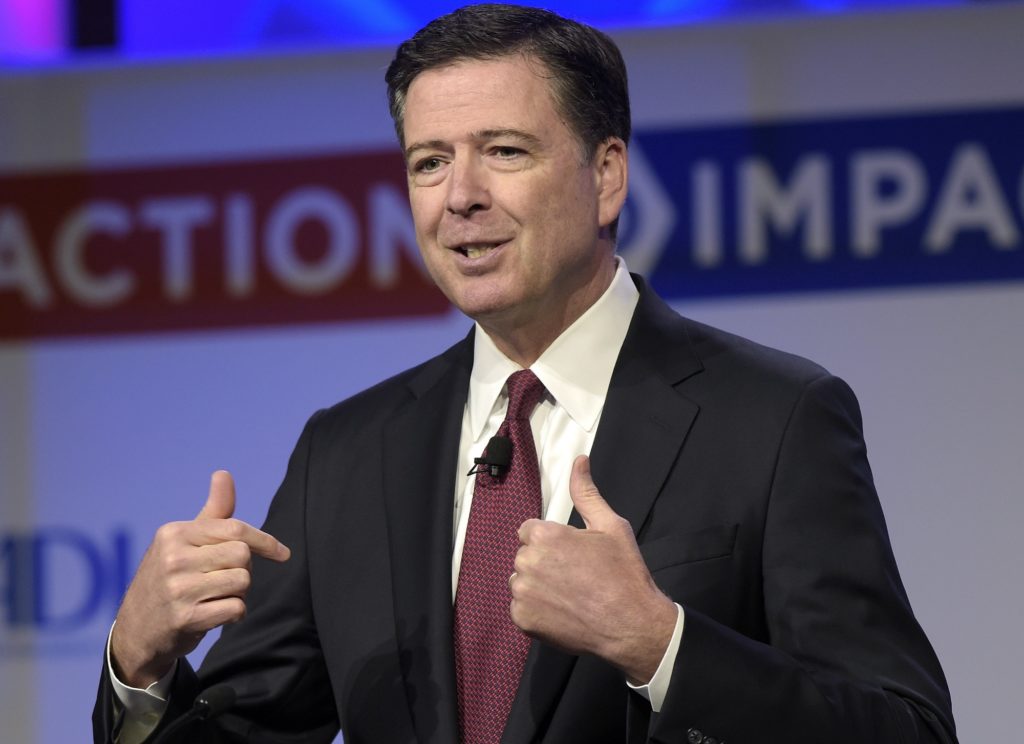 FILE - In this May 8, 2017, file photo, then-FBI Director James Comey speaks to the Anti-Defamation League National Leadership Summit in Washington. The White House is disputing a report that President Donald Trump asked Comey to shut down an investigation into ousted national security adviser Michael Flynn. (AP Photo/Susan Walsh, File)