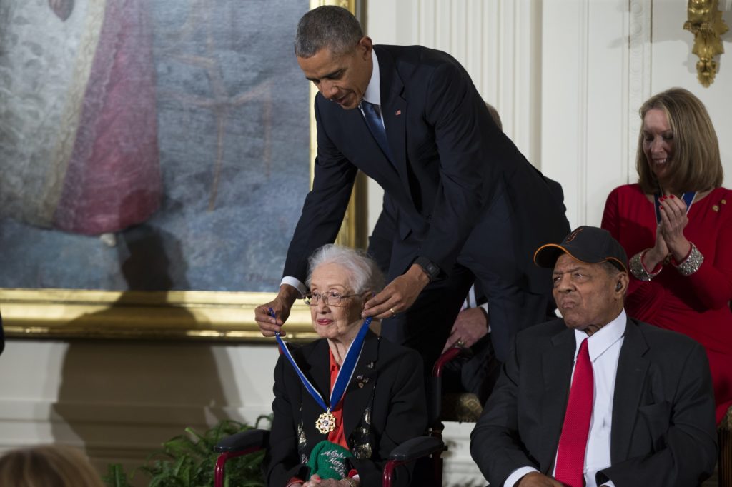 Willie Mays, right, looks on as President Barack Obama presents the Presidential Medal of Freedom to NASA mathematician Katherine Johnson during a ceremony in the East Room of the White House, on Tuesday, Nov. 24, 2015, in Washington. Obama is recognizing 17 people with the nations highest civilian award, including one of the greatest catchers in baseball history and a Funny Girl. (AP Photo/Evan Vucci)