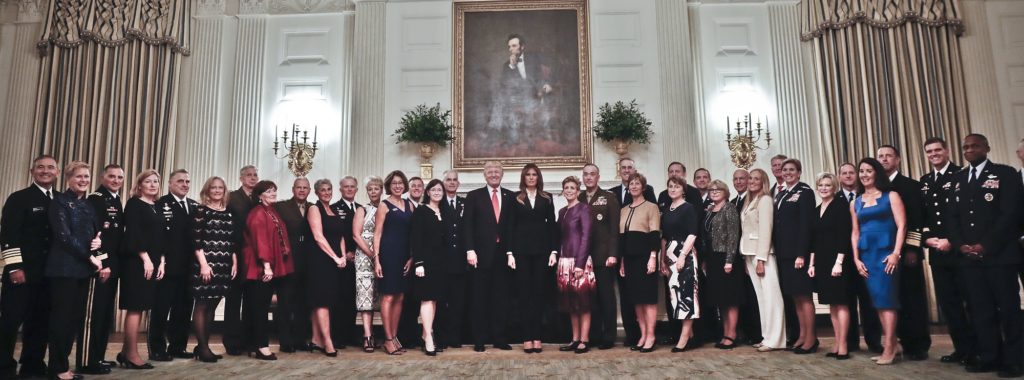 President Donald Trump and first lady Melania Trump, center, poses for a group photo with Senior Military leaders and spouses in the State Dining Room of the White House in Washington, Thursday, Oct. 5, 2017. Trump was hosting the dinner for the group this evening. (AP Photo/Pablo Martinez Monsivais)