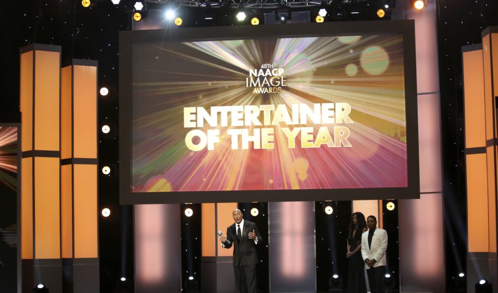 Dwayne Johnson accepts the award for entertainer of the year at the 48th annual NAACP Image Awards at the Pasadena Civic Auditorium on Saturday, Feb. 11, 2017, in Pasadena, Calif. (Photo by Matt Sayles/Invision/AP)