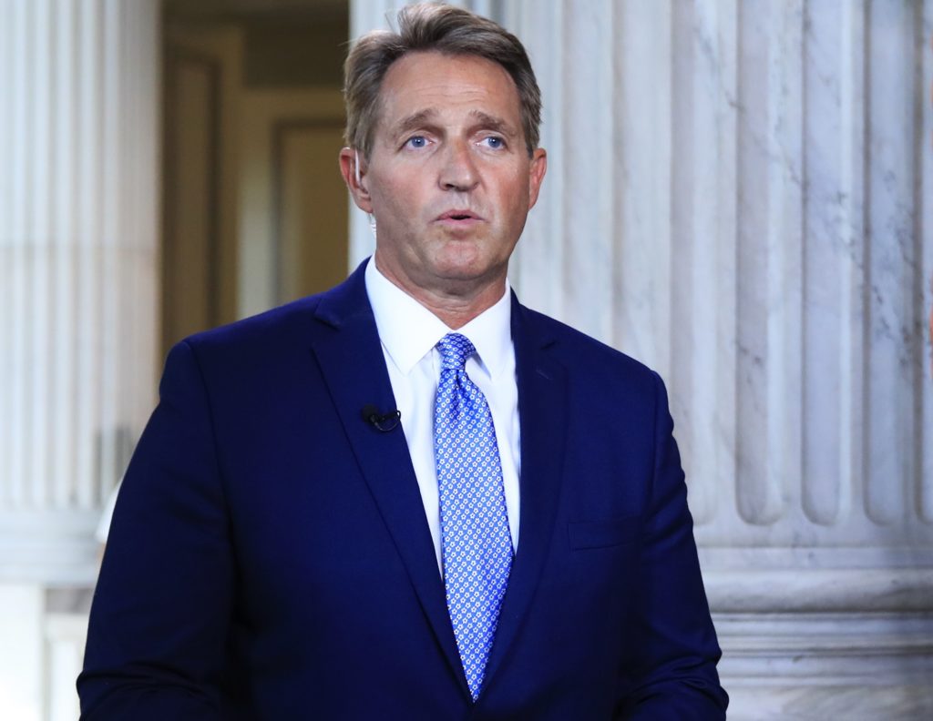 Sen. Jeff Flake, R-Ariz., speaks during a television interview on Capitol Hill in Washington, Tuesday, Oct. 24, 2017. Flake announced he would not run for re-election in 2018, condemning in a speech aimed at President Donald Trump the "flagrant disregard of truth and decency" that is undermining American democracy. (AP Photo/Manuel Balce Ceneta)