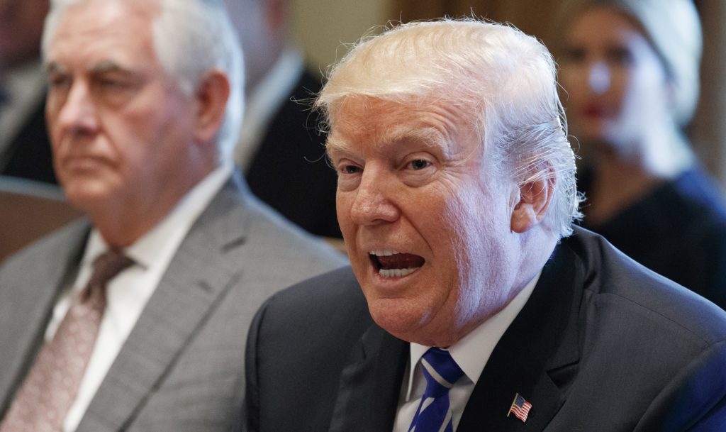 Secretary of State Rex Tillerson listens as President Donald Trump announces that the United States will designate North Korea a state sponsor of terrorism during a cabinet meeting at the White House, Monday, Nov. 20, 2017, in Washington. (AP Photo/Evan Vucci)