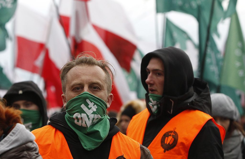 Demonstrators wave Polish flags during the annual march to commemorate Poland's National Independence Day in Warsaw, Poland, Saturday, Nov. 11, 2017. Thousands of nationalists marched in Warsaw on Poland's Independence Day holiday, taking part in an event that was organized by far-right groups. (AP Photo/Czarek Sokolowski)