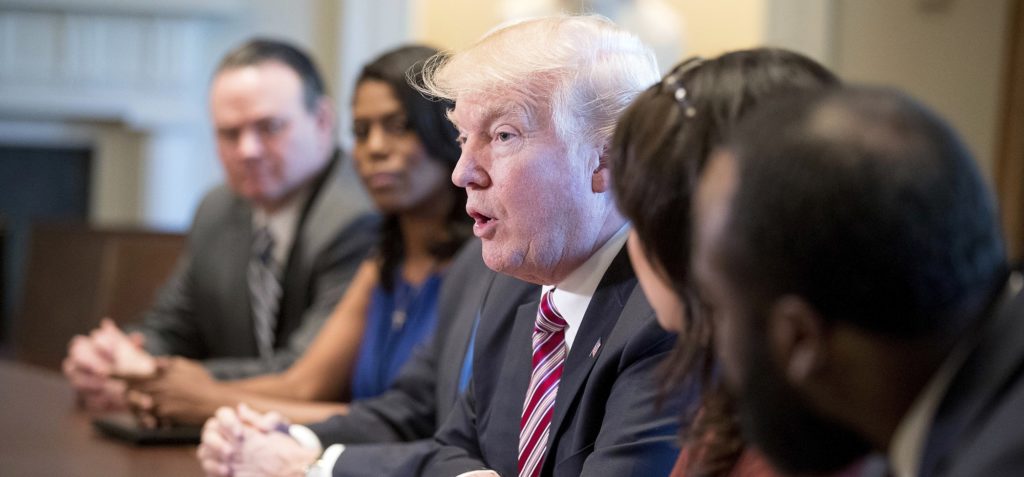 FILE - In this March 22, 2017, file photo, President Donald Trump meets with members of the Congressional Black Caucus in the Cabinet Room of the White House in Washington. On the campaign trail last year, then-Republican presidential nominee Donald Trump sought the support of black voters by asking them, “What the hell do you have to lose?” An answer came during the Congressional Black Caucus’ annual legislative conference this past week: Everything. (AP Photo/Andrew Harnik, File)