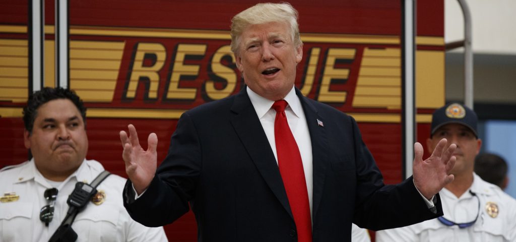 President Donald Trump speaks to first responders at West Palm Beach Fire Rescue, Wednesday, Dec. 27, 2017, in West Palm Beach, Fla. President Trump who is spending the holidays at his private Mar-a-Lago estate and club in Florida thanked the firefighters for their service. (AP Photo/Evan Vucci)