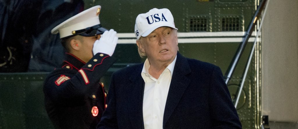 President Donald Trump steps off Marine One on the South Lawn at the White House in Washington, Sunday, Dec. 17, 2017, after returning from Camp David in Maryland. (AP Photo/Andrew Harnik)
