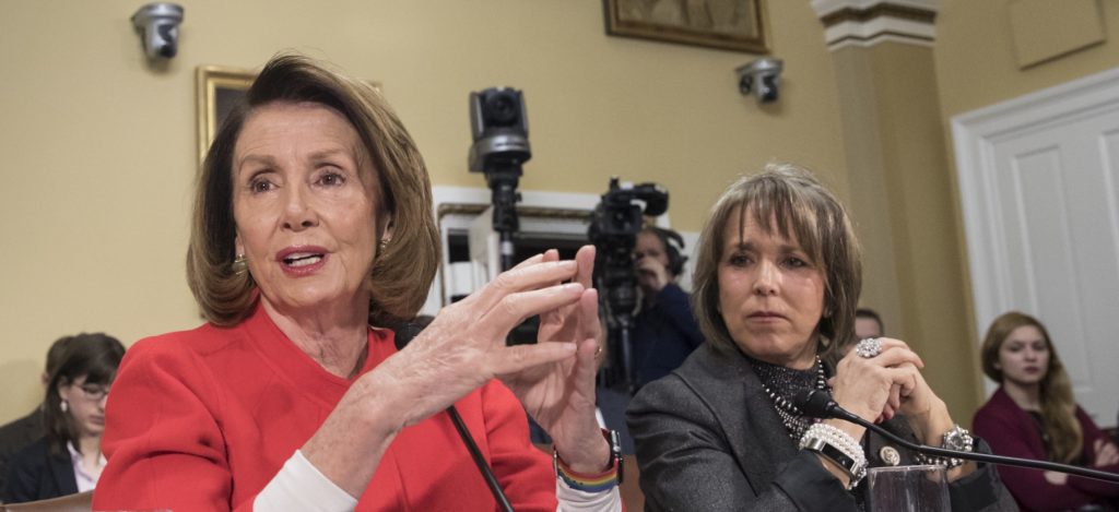 House Minority Leader Nancy Pelosi, D-Calif., and Hispanic Caucus Chair Rep. Michelle Lujan Grisham, D-N.M., right, appear before the House Rules Committee asking to add protections to the government funding bill for immigrants brought to the U.S. illegally as children, known as "dreamers," on Capitol Hill, in Washington, Thursday, Dec. 21, 2017. With a government shutdown clock ticking toward a midnight Friday deadline, House Republican leaders struggled on Wednesday to unite the GOP rank and file behind a must-pass temporary spending bill. (AP Photo/J. Scott Applewhite)