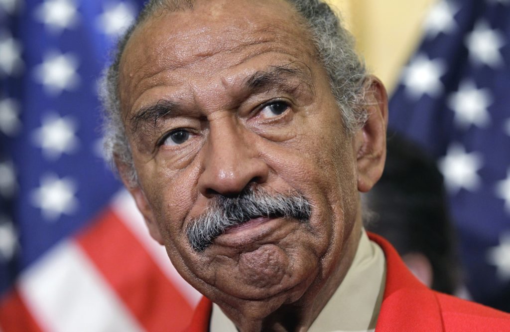 Rep. John Conyers, D-Mich., the ranking member of the House Judiciary Committee, listens during a news conference on Capitol Hill in Washington, Monday, April 4, 2011, to discuss efforts to thwart the harm done to the economy by online vendors dealing in counterfeit goods or copyright infringement. (AP Photo/J. Scott Applewhite)