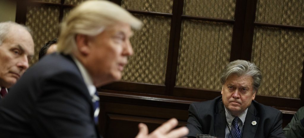White House Chief Strategist Steve Bannon listens at right as President Donald Trump speaks during a meeting on cyber security in the Roosevelt Room of the White House in Washington, Tuesday, Jan. 31, 2017. (AP Photo/Evan Vucci)