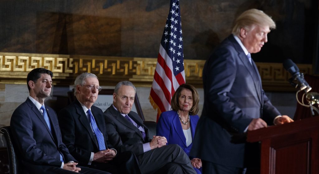 President Donald Trump speaks during a Congressional Gold Medal ceremony honoring former Senator Bob Dole on Capitol Hill, Wednesday, Jan. 17, 2018, in Washington. From left, Speaker of the House Rep. Paul Ryan, R-Wis., Senate Majority Leader Sen. Mitch McConnell, R-Ky., Senate Minority Leader Sen. Chuck Schemer, D-N.Y., and House Minority Leader Rep. Nancy Pelosi, D-Calif. (AP Photo/Evan Vucci)
