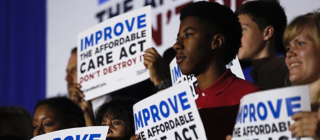 Supporters of Sen. Bernie Sanders, I-Vt., listen as he speaks during a "Care Not Cuts" rally in support of the Affordable Care Act, Sunday, July 9, 2017, in Covington, Ky. (AP Photo/John Minchillo)