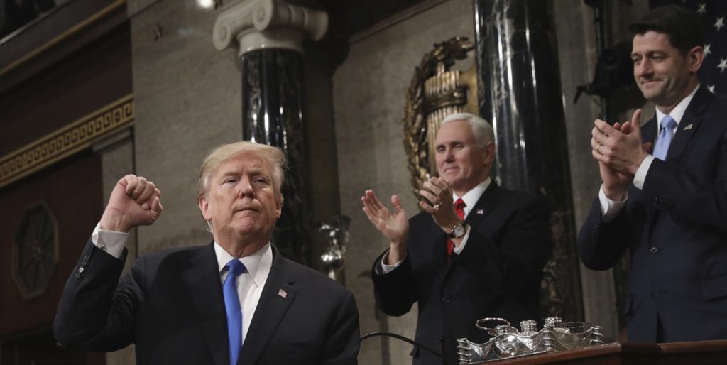 President Donald Trump gestures as he finishes his first State of the Union address in the House chamber of the U.S. Capitol to a joint session of Congress Tuesday, Jan. 30, 2018 in Washington, as Vice President Mike Pence and House Speaker Paul Ryan applaud. (Win McNamee/Pool via AP)