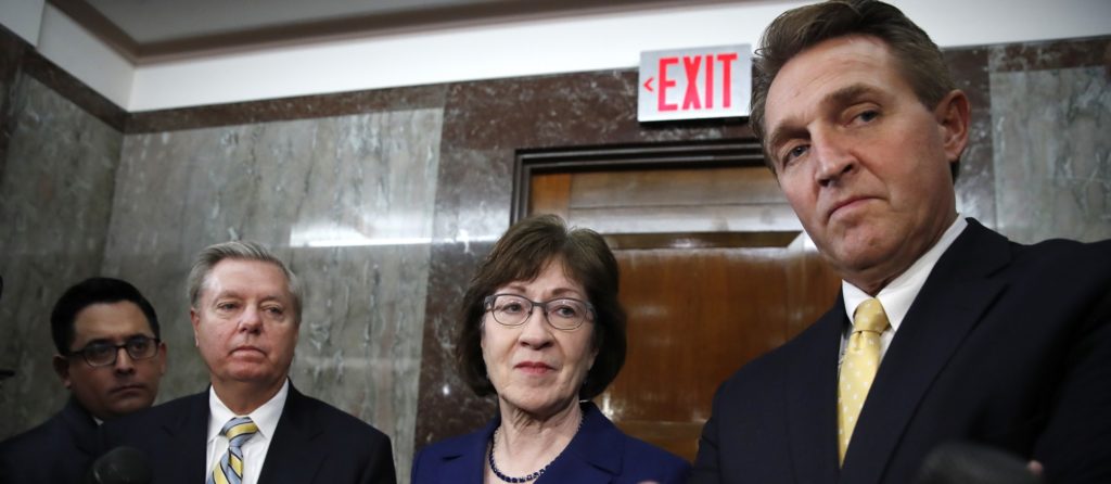 Sen. Lindsey Graham, R-S.C., left, Sen. Susan Collins, R-Maine, and Sen. Jeff Flake, R-Ariz., listen to a question from the media after attending a bipartisan meeting of senators, Monday Jan. 22, 2018, on Capitol Hill in Washington on day three of the government shutdown. (AP Photo/Jacquelyn Martin)