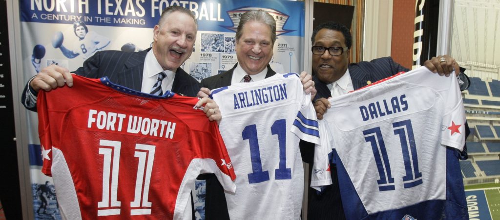 Fort Worth, Texas Mayor Mike Moncrief, left, Arlington, Texas Mayor Robert Cluck, center, and Dallas Deputy Mayor Pro Tem Dwaine Caraway pose for photographers after a news conference for the 2011 Super Bowl, Thursday, Feb. 26, 2009, in Fort Worth, Texas. Fort Worth will host the AFC championship team. Dallas will host the NFC champs. The new $1.2 billion Cowboys stadium, is in Arlington, midway between the two cities. (AP Photo/Matt Slocum)