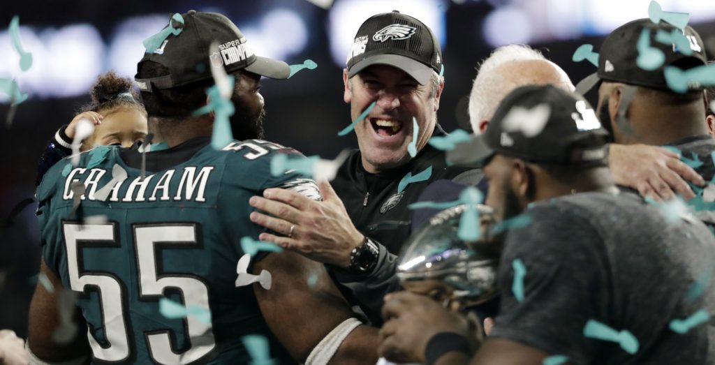 Philadelphia Eagles head coach Doug Pederson celebrates with defensive end Brandon Graham (55) and other players after winning the NFL Super Bowl 52 football game against the New England Patriots, Sunday, Feb. 4, 2018, in Minneapolis. The Eagles won 41-33. (AP Photo/Tony Gutierrez)