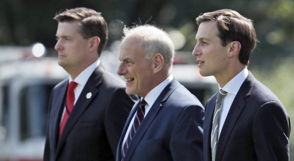 FILE - In this Aug. 4, 2017 file photo, from left, White House Staff Secretary Rob Porter, White House Chief of Staff John Kelly, and White House senior adviser Jared Kushner walk to Marine One on the South Lawn of the White House in Washington. President Donald Trump was en route to Bedminster, N.J., for vacation.  White House staff secretary Porter has resigned following allegations of domestic abuse by his two ex-wives.   (AP Photo/Alex Brandon)