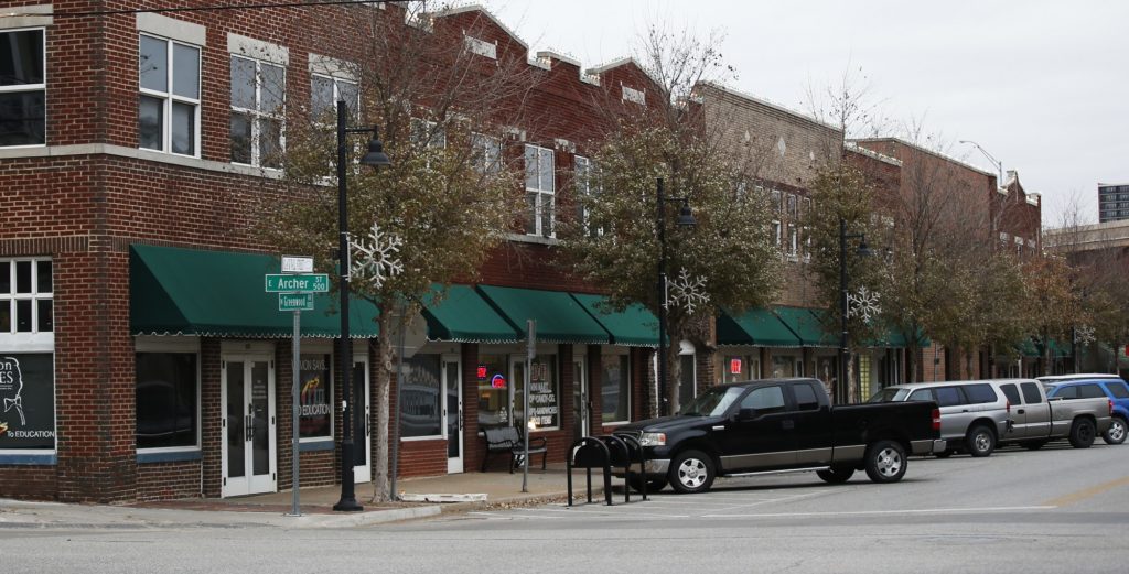 In this Thursday, Dec. 15, 2016 photo, a handful of businesses line Greenwood Avenue, the location of the former Black Wall Street, in Tulsa, Okla. Black leaders want to bring 100 new companies to the former Black Wall Street in north Tulsa by 2021, the 100th anniversary of its fall. The initiative seeks to recapture the entrepreneurial spirit that helped make it one of the country’s most affluent black areas. (AP Photo/Sue Ogrocki)