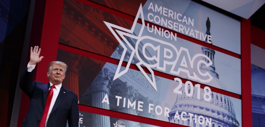 President Donald Trump waves after delivering remarks to the Conservative Political Action Conference, Friday, Feb. 23, 2018, in Oxon Hill, Md. (AP Photo/Evan Vucci)
