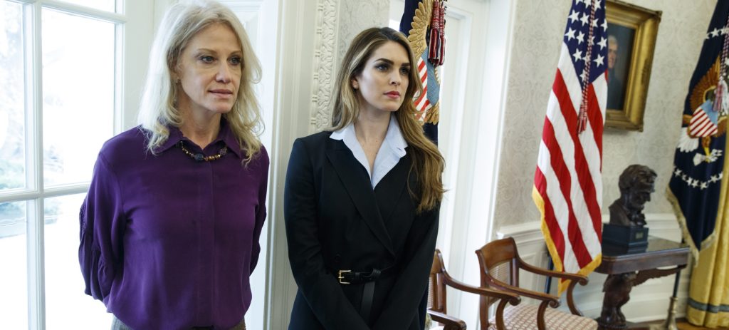 White House Communications Director Hope Hicks, right, stands with White House senior adviser Kellyanne Conway during a meeting in the Oval Office between President Donald Trump and Shane Bouvet, Friday, Feb. 9, 2018, in Washington. (AP Photo/Evan Vucci)