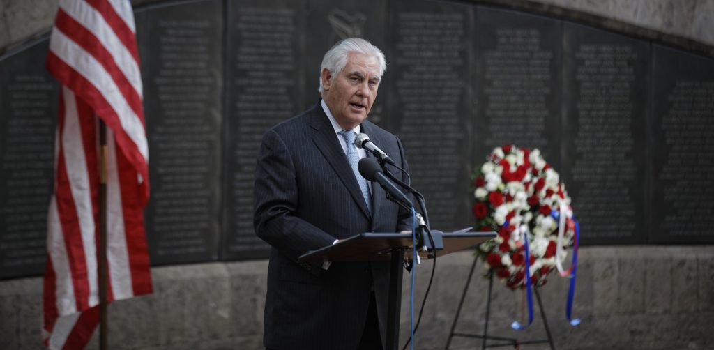 U.S. Secretary of State Rex Tillerson speaks to survivors after laying a wreath during a ceremony at Memorial Park in honor of the victims of the deadly 1998 U.S. Embassy bombing, in Nairobi, Kenya, Sunday, March 11, 2018. In 1998 the US embassies were bombed in near simultaneous attacks in two East African cities, in which over 200 people were killed. (AP Photo/Ben Curtis)