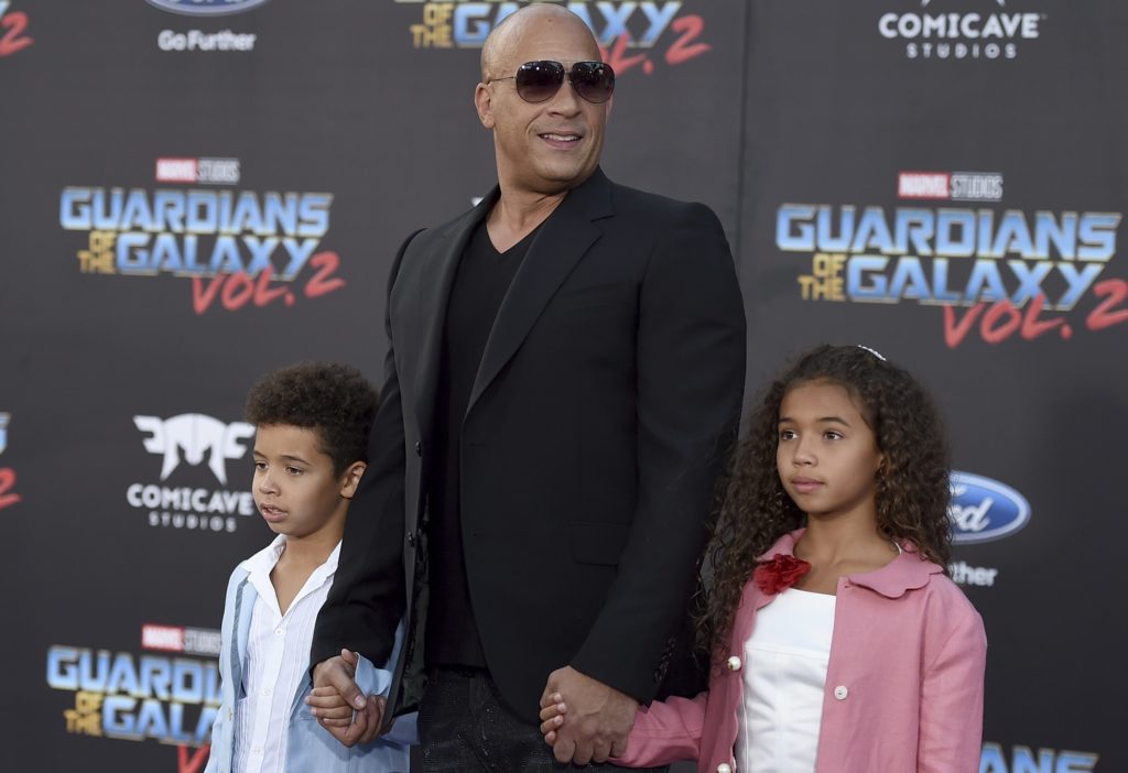 Vin Diesel, center, and his children, form left, Vincent Sinclair and Hania Riley Sinclair arrive at the world premiere of "Guardians of the Galaxy Vol. 2" at the Dolby Theatre on Wednesday, April 19, 2017, in Los Angeles. (Photo by Jordan Strauss/Invision/AP)