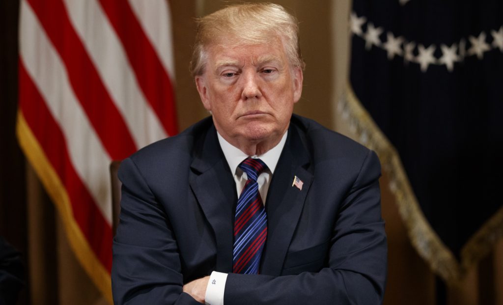 President Donald Trump listens during a meeting with governors and lawmakers in the Cabinet Room of the White House, Thursday, April 12, 2018, in Washington. (AP Photo/Evan Vucci)