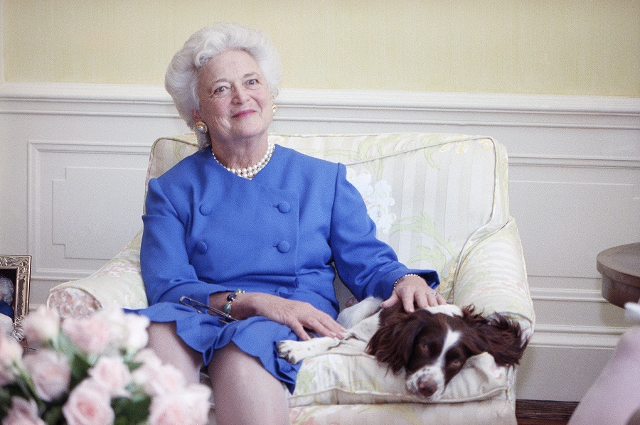 First Lady Barbara Bush poses with her dog Millie in 1990. (AP Photo/Doug Mills)