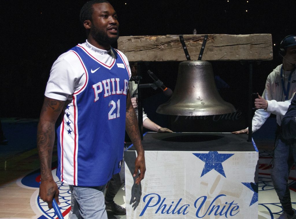 CORRECTS TO MEEK MILL NOT MEEK MILLS Rapper Meek Mill comes out to ring a Liberty Bell replica before the first half in Game 5 of a first-round NBA basketball playoff series between the Miami Heat and the Philadelphia 76ers, Tuesday, April 24, 2018, in Philadelphia. (AP Photo/Chris Szagola)
