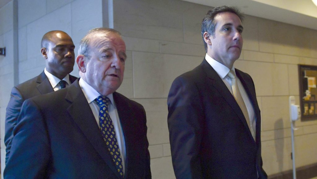 Michael Cohen, right, President Donald Trump's personal attorney walks with his attorney Stephen M. Ryan, center, on Capitol Hill in Washington, Tuesday, Oct. 24, 2017, after an interview with the House Intelligence Committee. (AP Photo/Susan Walsh)