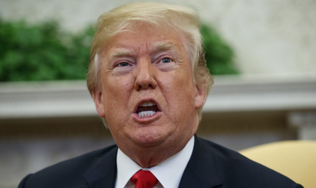 President Donald Trump speaks during a meeting with NATO Secretary General Jens Stoltenberg in the Oval Office of the White House, Thursday, May 17, 2018, in Washington. A year into his investigation, special counsel Robert Mueller is everywhere and nowhere at the same time. In that time, the breadth and stealth of his investigation has rattled the White House and its chief occupant, and has spread to Capitol Hill, K Street, foreign governments and, as late as last week, corporate boardrooms.(AP Photo/Evan Vucci)
