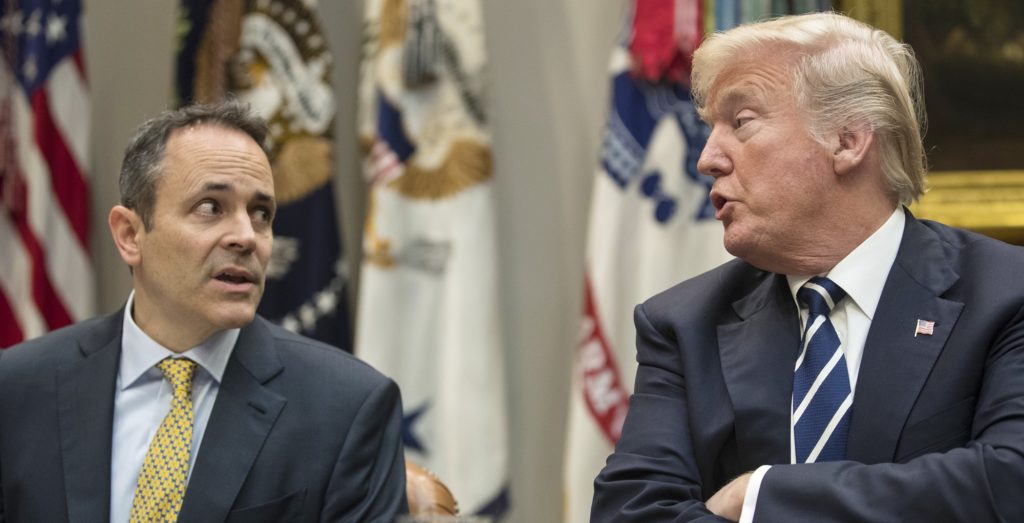 FILE - In this Thursday, Jan. 11, 2018, file photo, President Donald Trump, right, and Kentucky Gov. Matt Bevin, left, talk during a prison reform roundtable in the Roosevelt Room of the Washington. Kentucky has become the first state to win approval from the Trump administration requiring many of its Medicaid recipients to work to receive coverage. The Trump administration gave the go ahead Friday, Jan. 12, 2018. (AP Photo/Carolyn Kaster, File)