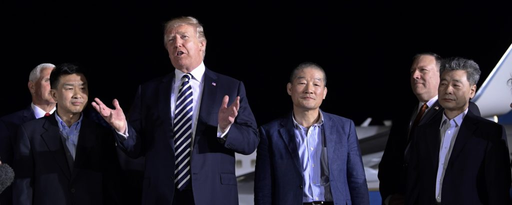 President Donald Trump speaks as he stands with Tony Kim, second left, Kim Dong Chul, center right, and Kim Hak Song, right, three Americans detained in North Korea for more than a year after they arrived at Andrews Air Force Base in Md., Thursday, May 10, 2018. Vice President Mike Pence, left, and Secretary of State Mike Pompeo, second from right, listen. (AP Photo/Susan Walsh)
