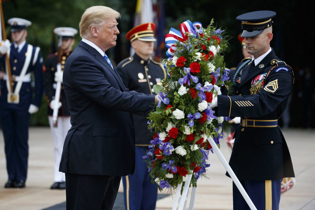 President Donald Trump lays a wreath during a Memorial Day ceremony at Arlington National Cemetery, Monday, May 28, 2018, in Arlington, Va. (AP Photo/Evan Vucci)