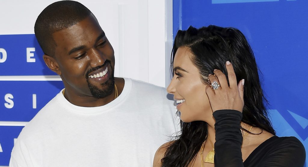 FILE - In this Aug. 28, 2016 file photo, Kanye West, left, and Kim Kardashian West arrive at the MTV Video Music Awards in New York. Armed robbers forced their way into a private Paris residence early Monday, Oct. 3, where Kim Kardashian West was staying and tied her up, police officials said. They said five assailants, who are still at large, stole a jewelry box containing valuables worth 6 million euros ($6.7 million) as well as a ring worth 4 million euros ($4.5 million.) (Photo by Evan Agostini/Invision/AP, File)