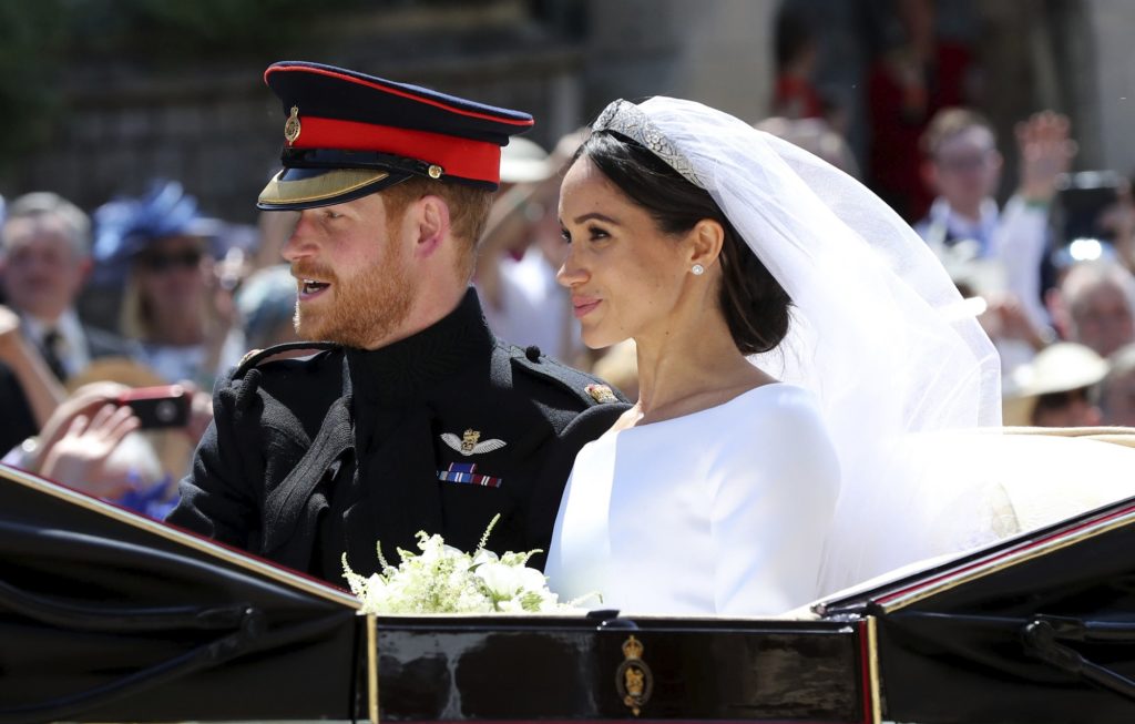 Britain's Prince Harry and his wife Meghan Markle leave after their wedding ceremony, at St. George's Chapel in Windsor Castle in Windsor, near London, England, Saturday, May 19, 2018. (Gareth Fuller/pool photo via AP)