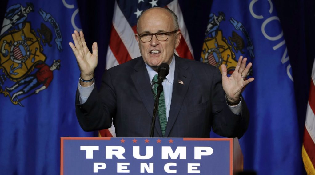 FILE- In this Nov. 1, 2016 file photo, former New York City Mayor Rudy Giuliani campaigns for Republican presidential candidate Donald Trump at the University of Wisconsin Eau Claire in Eau Claire, Wis. On Friday, Dec. 9, 2016, President-elect Donald Trump announced that Giuliani has taken his name out of the running for a cabinet position in the Trump administration. (AP Photo/Matt Rourke)