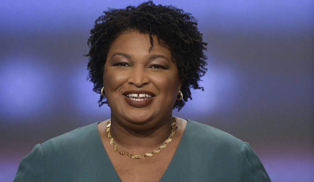 In this May 20, 2018, photo, Georgia Democratic gubernatorial candidate Stacey Abrams participates in a debate against Stacey Evans in Atlanta. In Georgia, black women will likely factor into one of the country's marquee political contests. The Democratic race for governor features two women, and candidate Abrams is running to become the first black woman ever elected governor in America. (AP Photo/John Amis)