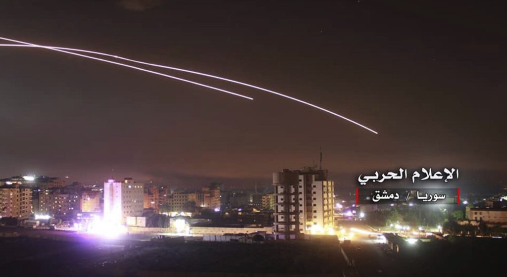 This photo provided early Thursday, May 10, 2018, by the government-controlled Syrian Central Military Media, shows missiles rise into the sky as Israeli missiles hit air defense position and other military bases, in Damascus, Syria. The Israeli military on Thursday said it attacked "dozens" of Iranian targets in neighboring Syria in response to an Iranian rocket barrage on Israeli positions in the Golan Heights, in the most serious military confrontation between the two bitter enemies to date. (Syrian Central Military Media, via AP)