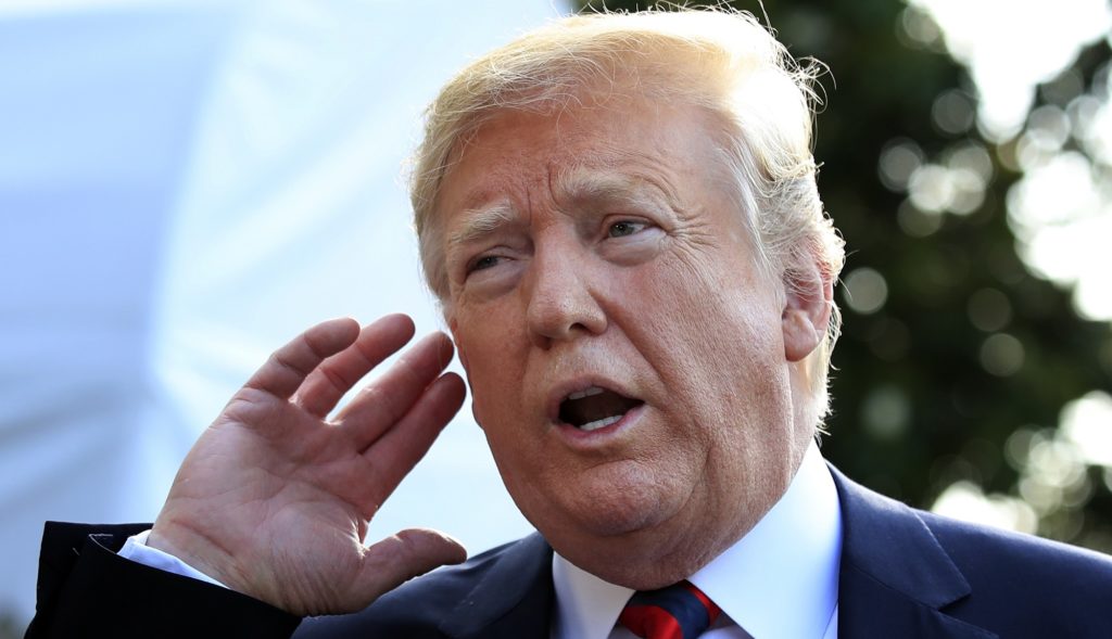President Donald Trump gestures as a he listens to a reporter asking a question before leaving the White House in Washington, Friday, June 8, 2018, to attend the G7 Summit in Charlevoix, Quebec, Canada. (AP Photo/Manuel Balce Ceneta)