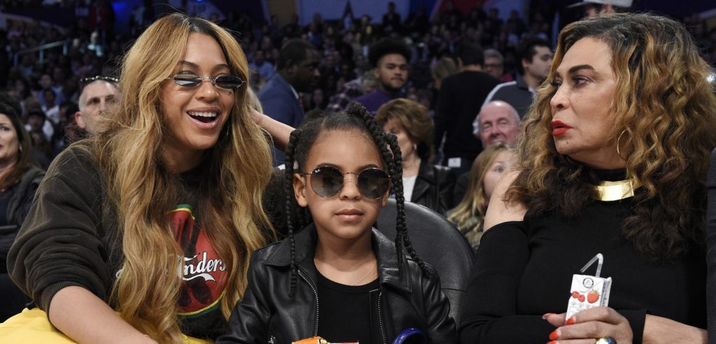 Singer Beyonce, left, sits with her daughter Blue Ivy Carter, center, and her mother Tina Knowles during the second half of an NBA All-Star basketball game, Sunday, Feb. 18, 2018, in Los Angeles. (AP Photo/Chris Pizzello)
