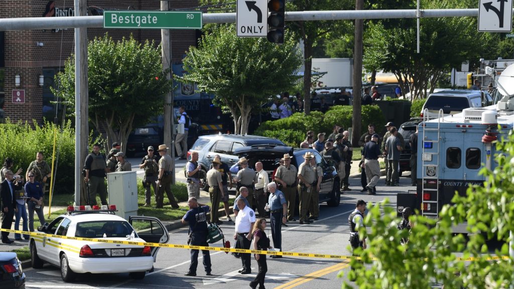Police secure the scene of a shooting at an office building housing The Capital Gazette newspaper in Annapolis, Md., Thursday, June 28, 2018. (AP Photo/Susan Walsh)