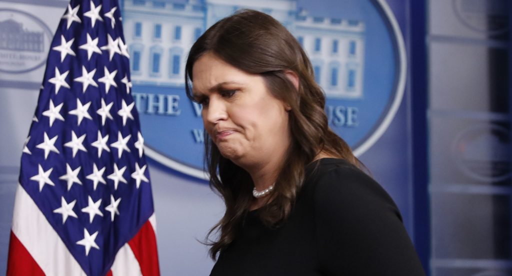 White House press secretary Sarah Huckabee Sanders walks away from the podium after speaking to the media at the daily briefing in the Brady Press Briefing Room of the White House, Thursday, June 14, 2018. (AP Photo/Pablo Martinez Monsivais)