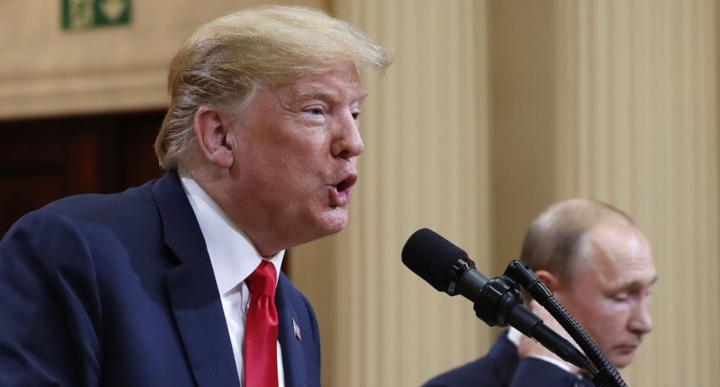 U.S. President Donald Trump speaks with Russian President Vladimir Putin during a press conference after their meeting at the Presidential Palace in Helsinki, Finland, Monday, July 16, 2018. (AP Photo/Pablo Martinez Monsivais)