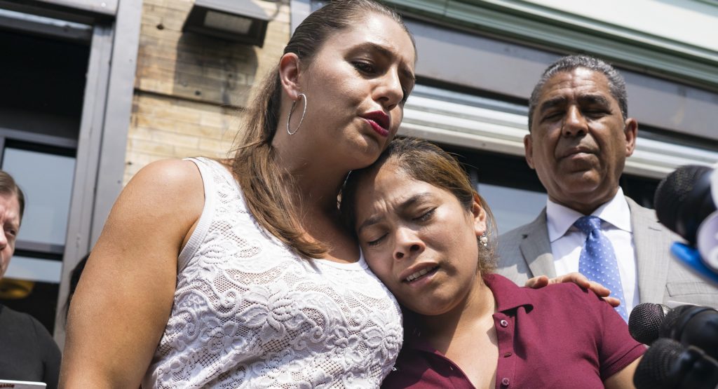 Yeni Gonzalez, a Guatemalan mother who was separated from her three children at the U.S.-Mexico border, right, is embraced by volunteer Janey Pearl during a news conference Tuesday, July 3, 2108 in New York. Gonzalez saw her children for the first time since mid May. She was driven cross-country by a team of volunteers after she was released from Eloy Detention Center in Arizona on Thursday. (AP Photo/Craig Ruttle)
