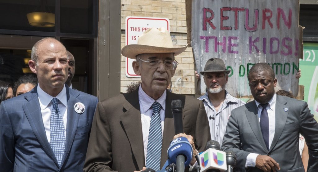 Attorney Michael Avenatti, left, stands with co-councel Ricardo de Anda as he speaks to reporters during news conference outside the Cayuga Centers offices Harlem, Wednesday, July 11, 2018, in New York. Avenatti represents children two Honduran girls shipped to New York after being separated from their parents at the Mexican border. The girls' parents are being detained in Texas by the Immigration and Customs Enforcement agency. (AP Photo/Mary Altaffer)