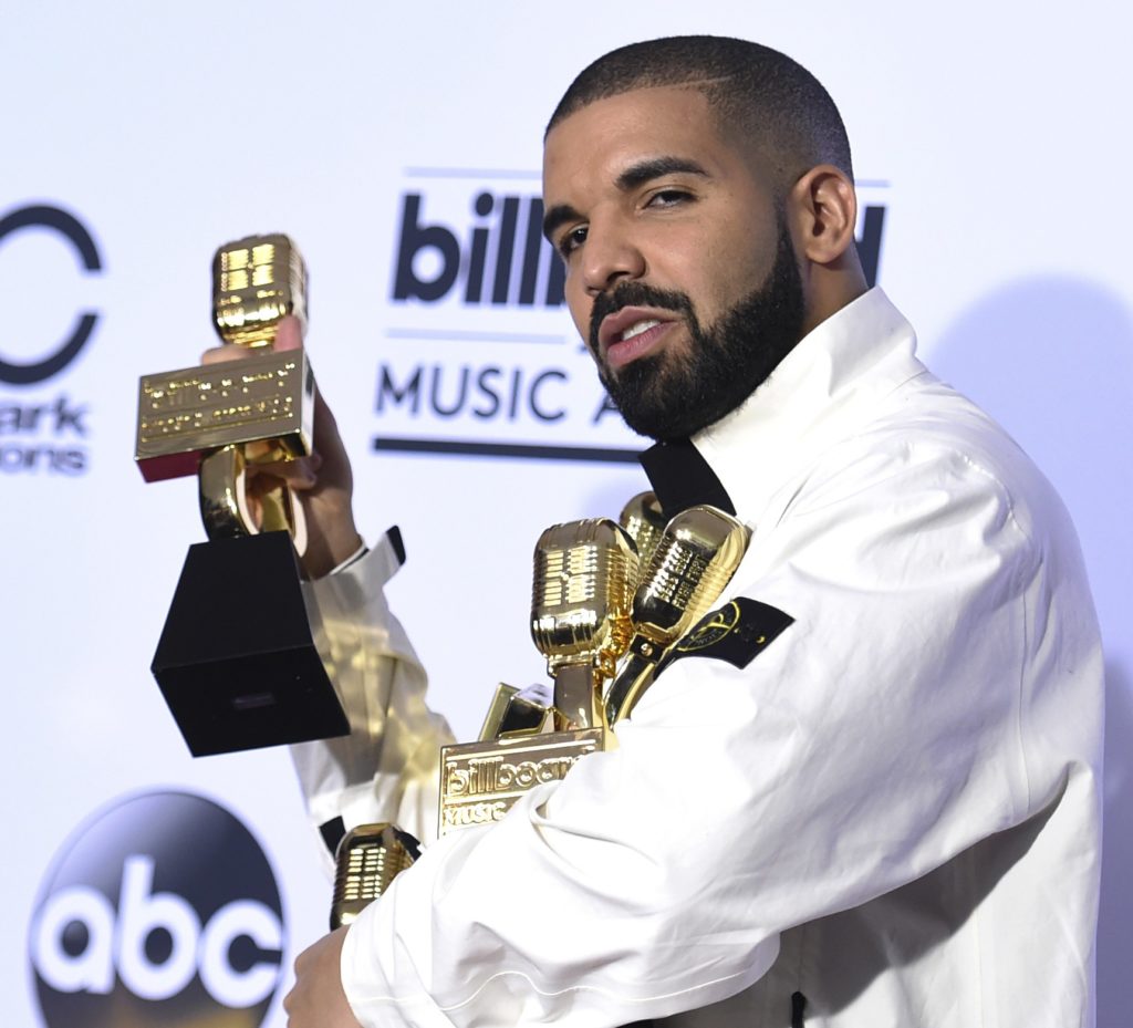 Drake poses in the press room with his 13 awards at the Billboard Music Awards at the T-Mobile Arena on Sunday, May 21, 2017, in Las Vegas. Drake won for Top Artist, Top Male Artist, Top Billboard 200 Album for "Views," Top Billboard 200 Artist, Top Hot 100 Artist, Top Song Sales Artist, Top Steaming Songs Artist, Top Rap Artist, Top Rap Tour, Top Rap Album for "Views," Top Streaming Song (Audio) for "One Dance," Top R&B Song for "One Dance," and Top R&B Collaboration for "One Dance." (Photo by Richard Shotwell/Invision/AP)