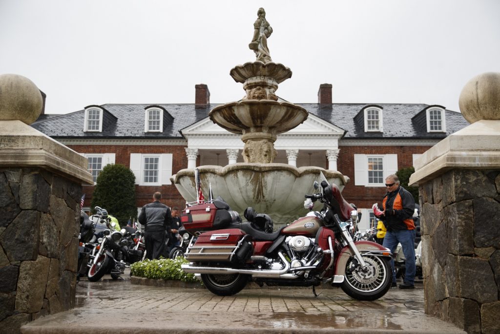 A Harley-Davidson motorcycle is parked with others in front of the clubhouse of Trump National Golf Club in Bedminster, N.J., Saturday, Aug. 11, 2018, before President Donald Trump meets with member of Bikers for Trump and supporters. (AP Photo/Carolyn Kaster)