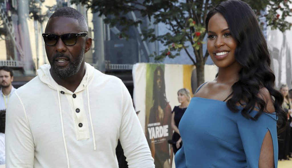 Director Idris Elba, left, and partner Sabrina Dhowre pose for photographers on arrival at the premiere of the film 'Yardie', in London, Tuesday, Aug. 21, 2018. (Photo by Grant Pollard/Invision/AP)