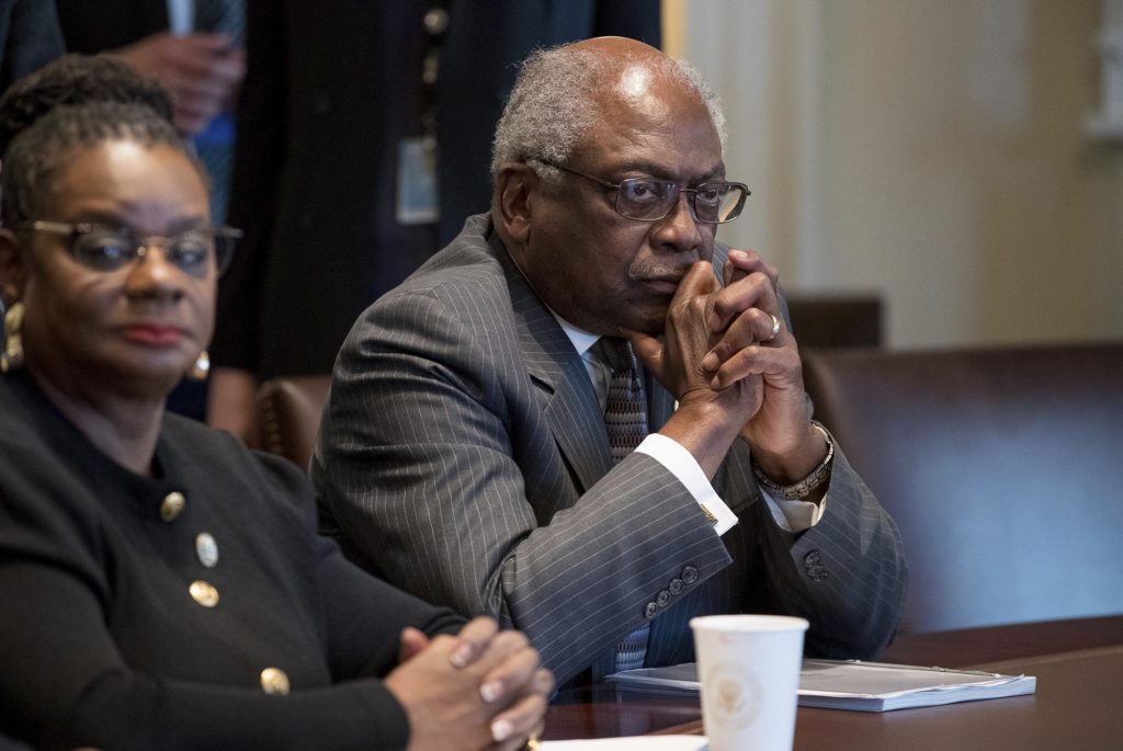 Rep. Gwen Moore, D-Wis., left, House Assistant Minority Leader James Clyburn of S.C., and other members of the Congressional Black Caucus meet with President Donald Trump in the Cabinet Room of the White House in Washington, Wednesday, March 22, 2017. (AP Photo/Andrew Harnik)